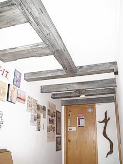 Some of the exposed old timbers on the second floor of The Old Stone Gallery