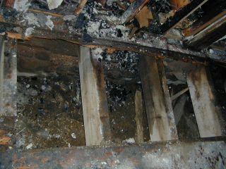 Old Stone Gallery fire picture.Burned joists
