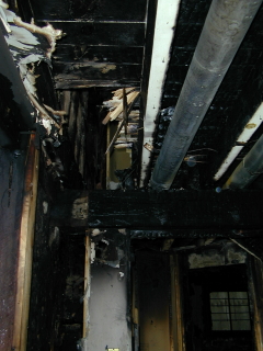 Old Stone Gallery fire picture.Charred ceiling
