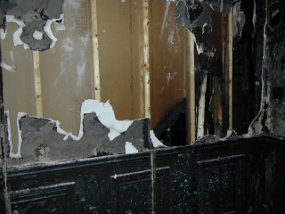 Old Stone Gallery fire picture. Charred wooden panels