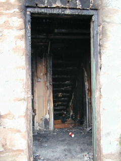 Old Stone Gallery fire picture.Old pine floor destroyed