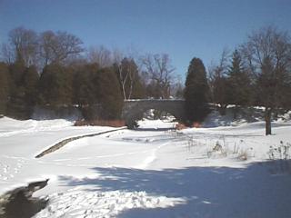 View of Websters Falls park and Cobblestone Bridge in Winter
